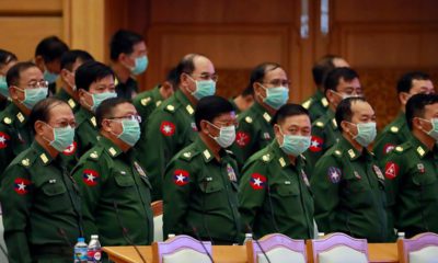 Photo of military representatives wearing masks