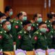 Photo of military representatives wearing masks