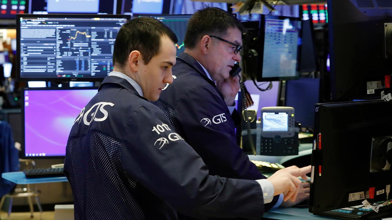 Photo of traders on the floor of the New York Stock Exchange