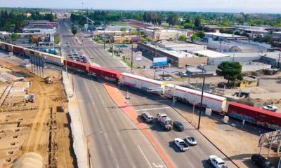 Aerial view of diagonal BNSF train crossing at Blackstone and McKinley avenues in Fresno, California