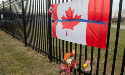 Photo of a Canadian flag at a tribute in Nova Scotia