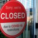 Photo of a sign indicating a shop is closed because of COVID-19 lockdown