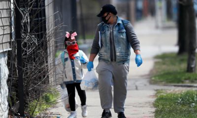 Photo of Erica Harris walking with her daughter in Chicago