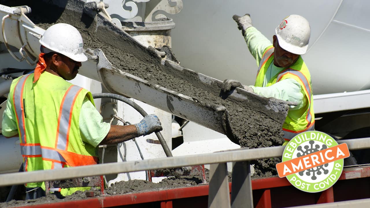 Construction workers pour concretecomposite