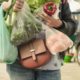 Photo of a woman holding grocery bags