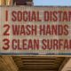 Photo of movie theater marquee with COVID-19 messages