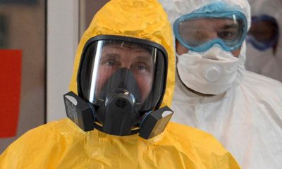 Photo of President Vladimir Putin wearing a protective suit