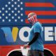 Photo of a man walking past an I Voted sign