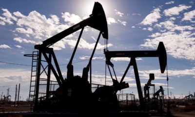 Photo of Kern County oil pumps set against a blue sky