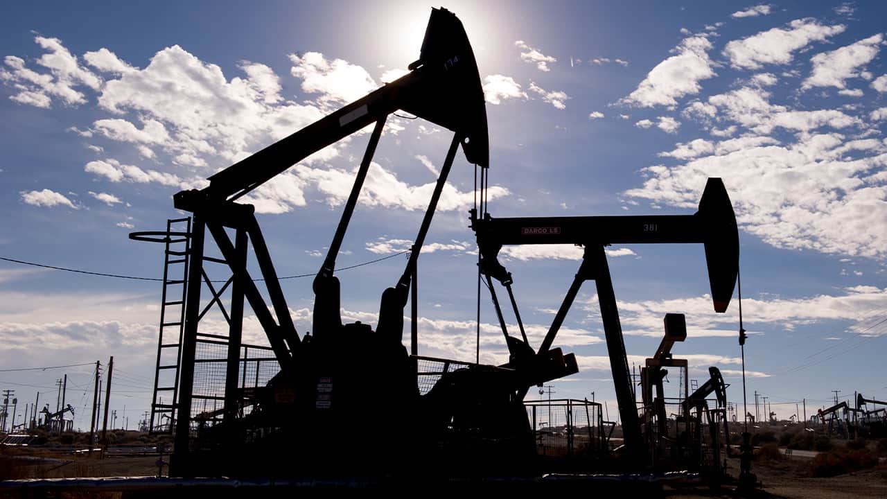 Photo of Kern County oil pumps set against a blue sky