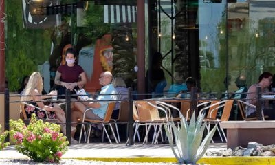 Photo of restaurant guests and mask wearing server in Phoenix, Arizona faguest