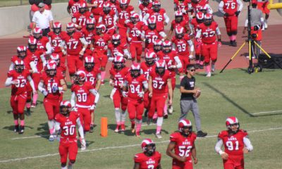 Fresno City College football team runs on to field