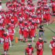 Fresno City College football team runs on to field