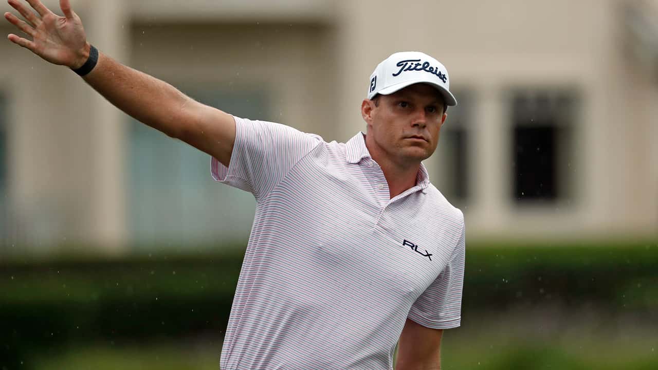 Image of PGA Tour player Nick Watney signaling after a tee shot