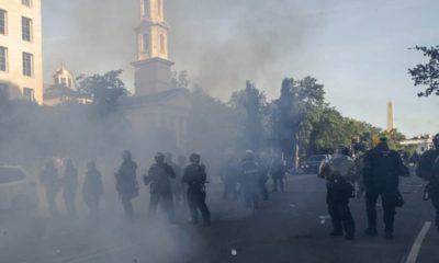 Photo of tear gas floating in the air around officers