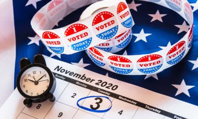 Image of calendar, an alarm clock, and I voted stickers for the November 2020 election