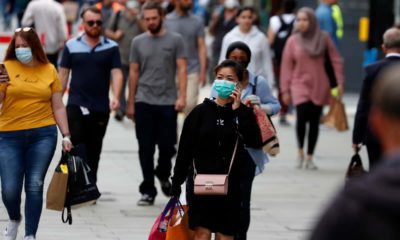 Photo of people wearing masks in London