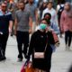 Photo of people wearing masks in London