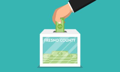 Illustration of hand putting dollars bills into a ballot box titled Fresno County