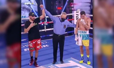 Photo of referee raising Jose Ramirez's hand in victory