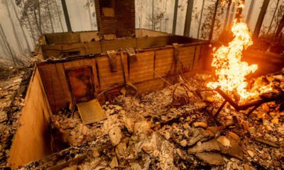 Flames burn at a home leveled by the Creek Fire along Highway 168 on Tuesday, Sept. 8, 2020, in Fresno County, Calif. (AP Photo/Noah Berger)