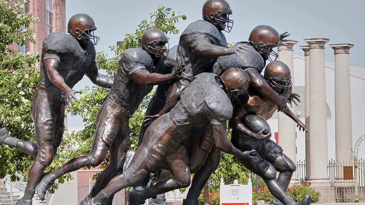 Photo of a statue of football players